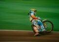 man riding motocross bike on panning photography