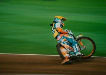 man riding motocross bike on panning photography