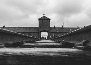 grayscale photo of concrete bridge