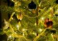 gold and silver baubles on green christmas tree