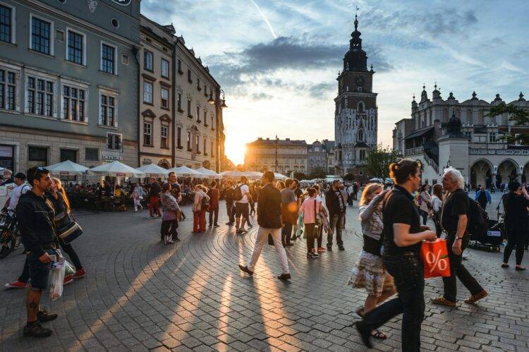 people walking on street near concrete buildings